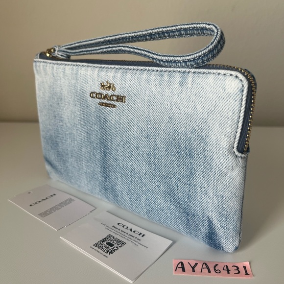 Coach Handbags - Coach Light Denim Wristlet Clutch with Gold Logo